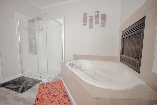full bathroom with a stall shower, crown molding, and a jetted tub