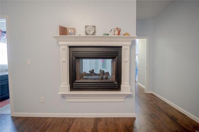 details with wood finished floors and baseboards