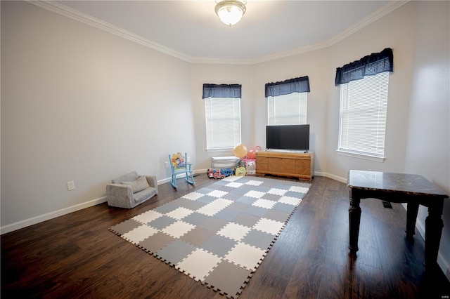 rec room featuring crown molding, wood finished floors, and baseboards