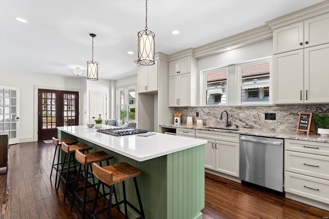 kitchen featuring recessed lighting, appliances with stainless steel finishes, decorative backsplash, and a sink