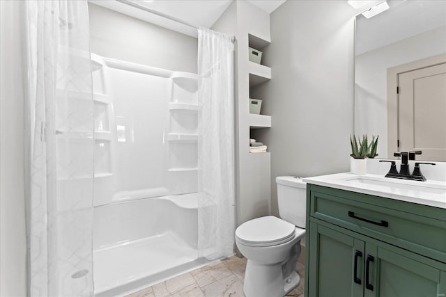 full bath with vanity, a shower stall, and toilet