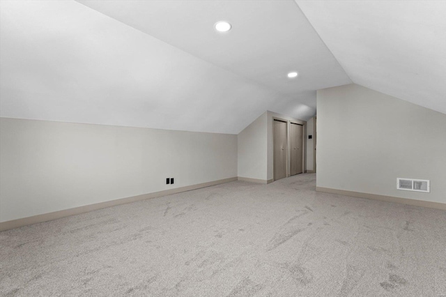 bonus room with recessed lighting, lofted ceiling, visible vents, light carpet, and baseboards