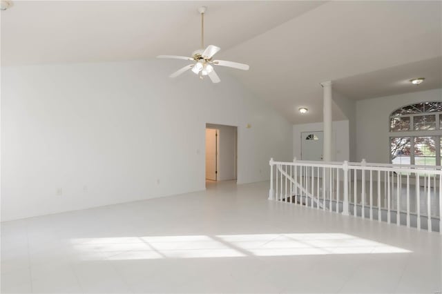 unfurnished room with high vaulted ceiling and ceiling fan