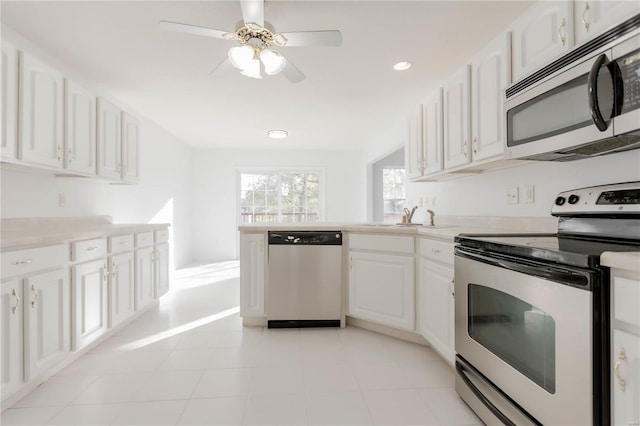 kitchen featuring white cabinets, ceiling fan, light countertops, and appliances with stainless steel finishes