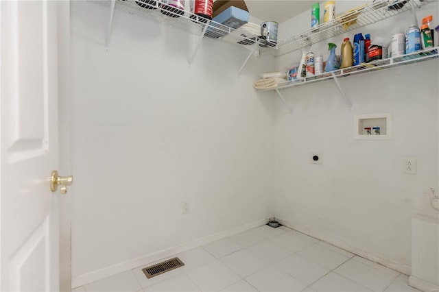 laundry room featuring laundry area, visible vents, hookup for an electric dryer, baseboards, and washer hookup