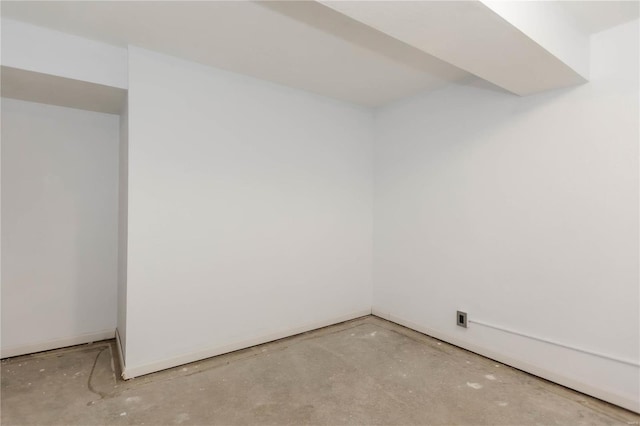 spare room with concrete flooring