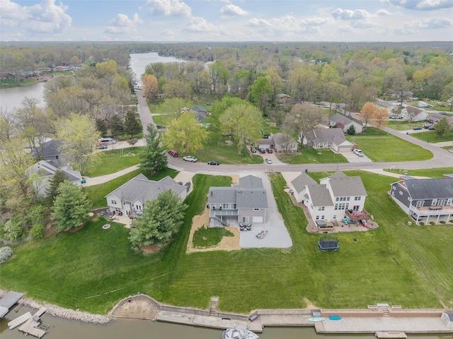 drone / aerial view with a residential view and a water view