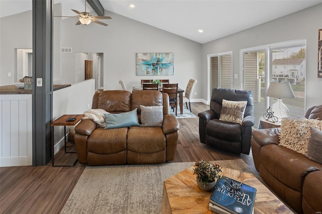 living area with visible vents, baseboards, a ceiling fan, and wood finished floors