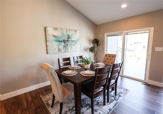 dining space with vaulted ceiling, wood finished floors, baseboards, visible vents, and recessed lighting