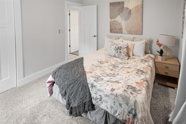 bedroom with baseboards and carpet flooring