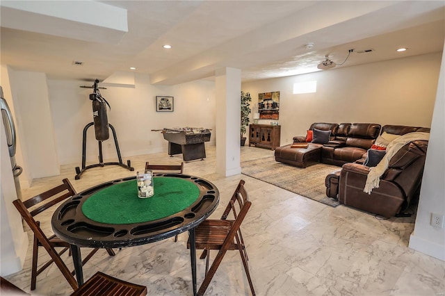 recreation room with recessed lighting, marble finish floor, and baseboards