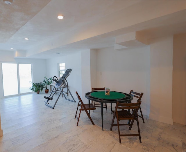 rec room with baseboards and recessed lighting
