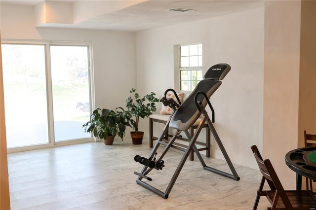 exercise room featuring visible vents