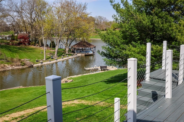 dock area featuring a yard and a water view