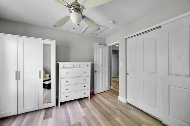 unfurnished bedroom with light wood-type flooring and a ceiling fan