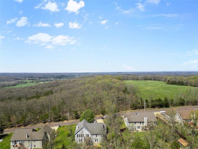 drone / aerial view featuring a view of trees
