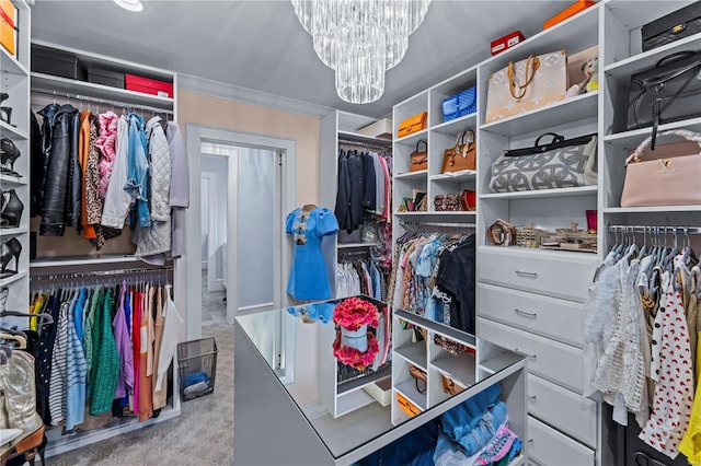 spacious closet with a notable chandelier