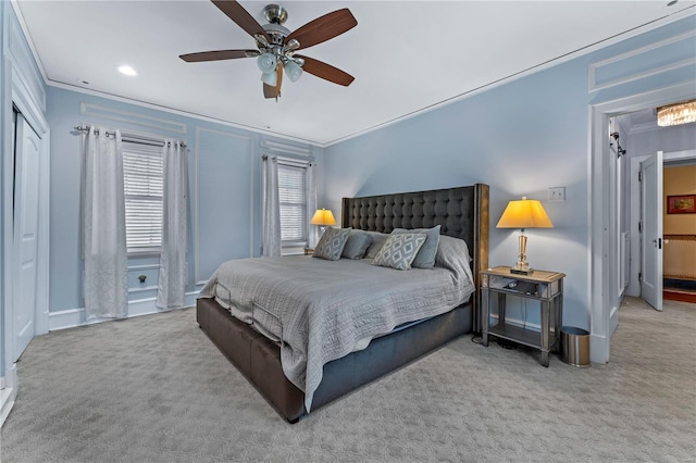 carpeted bedroom featuring crown molding, recessed lighting, baseboards, and ceiling fan