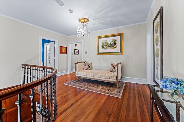 bedroom featuring wood-type flooring, crown molding, and a notable chandelier