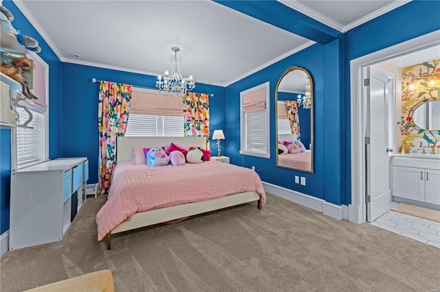 bedroom featuring crown molding, baseboards, ensuite bathroom, carpet flooring, and a notable chandelier