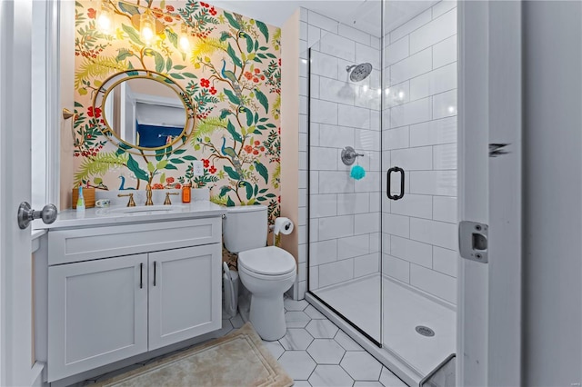 full bath with tile patterned flooring, vanity, toilet, wallpapered walls, and a shower stall