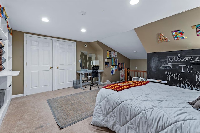 bedroom with a closet, lofted ceiling, baseboards, recessed lighting, and carpet