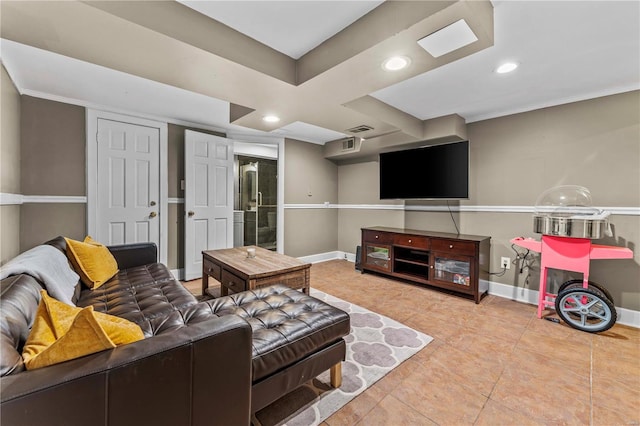 living area with recessed lighting, baseboards, visible vents, and tile patterned flooring