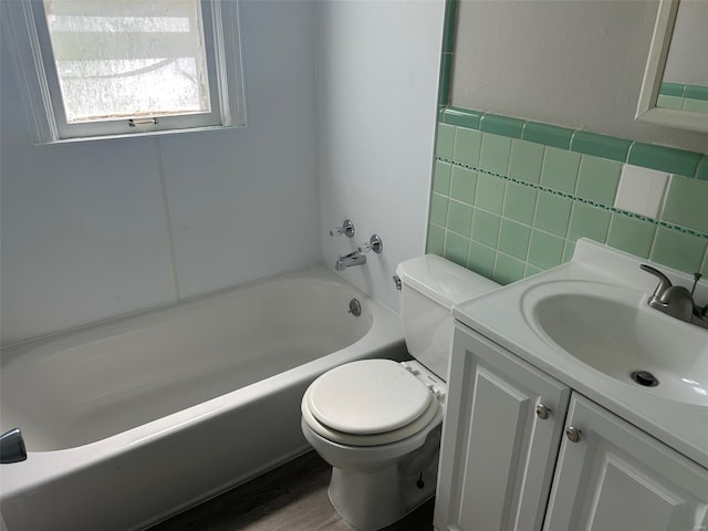 full bathroom featuring tile walls, vanity, shower / tub combination, and toilet