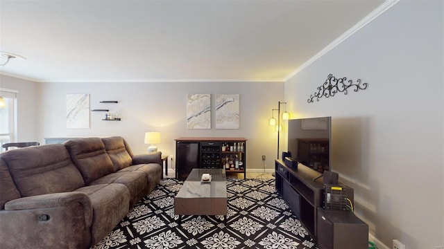 living room with baseboards and crown molding