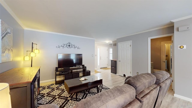 living area featuring baseboards, crown molding, and light wood finished floors