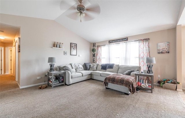 carpeted living room featuring vaulted ceiling, baseboards, and a ceiling fan