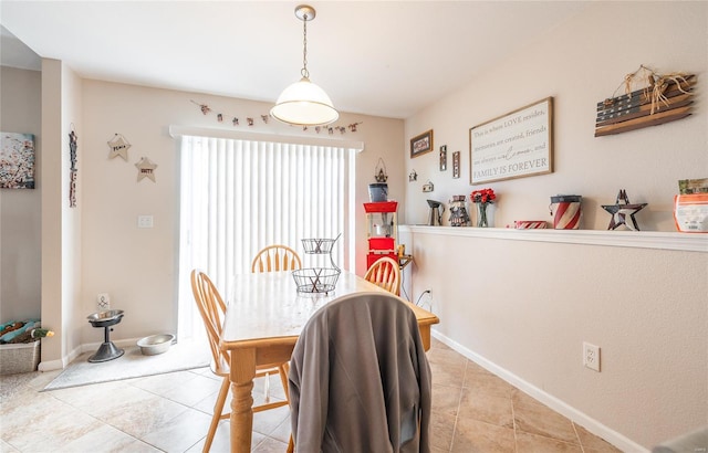 tiled dining space with baseboards
