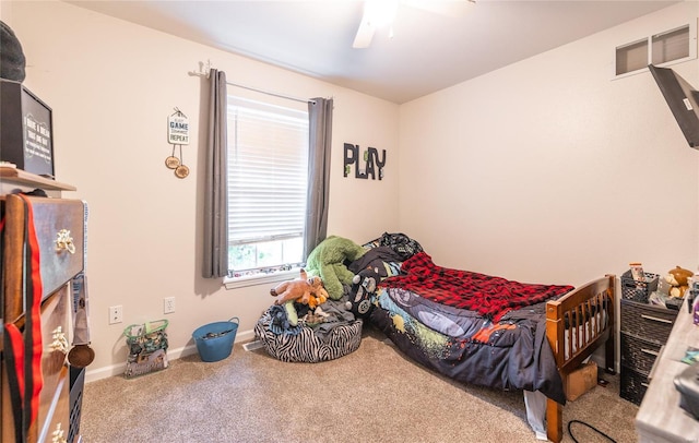carpeted bedroom with a ceiling fan, baseboards, and visible vents