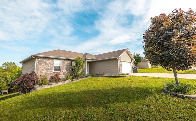 view of front of property with a front yard, brick siding, driveway, and a garage