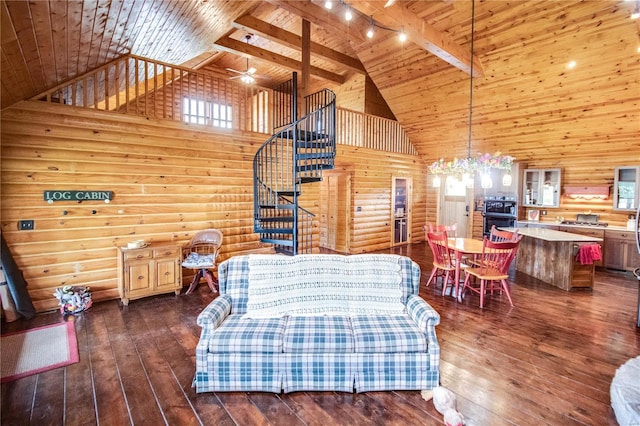 living area featuring wooden ceiling, high vaulted ceiling, and rustic walls