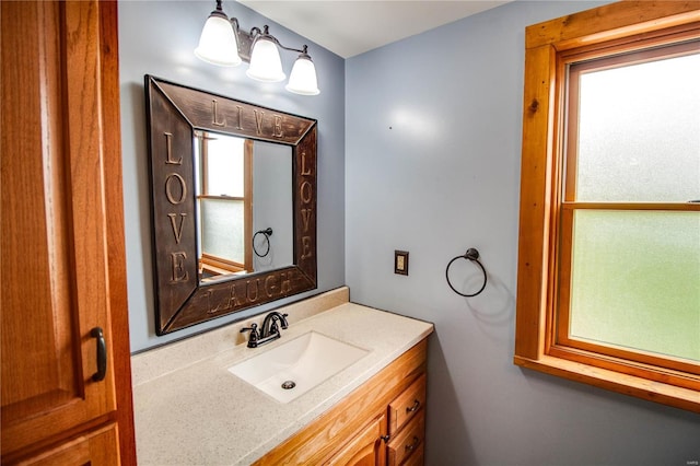 bathroom featuring a healthy amount of sunlight and vanity
