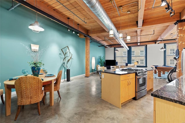 kitchen featuring finished concrete flooring, track lighting, stainless steel gas range, and wood ceiling