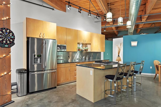 kitchen featuring a high ceiling, a kitchen bar, a center island, concrete floors, and appliances with stainless steel finishes