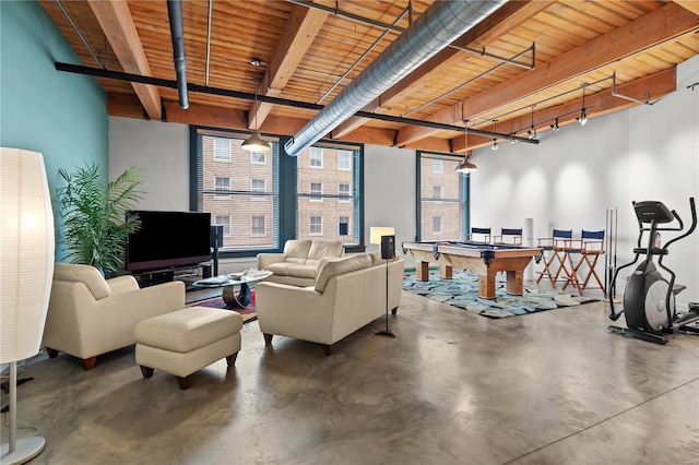 living room featuring wooden ceiling, pool table, concrete floors, and beam ceiling