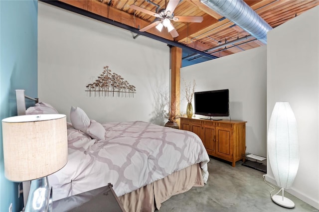 bedroom with baseboards, a ceiling fan, and concrete floors