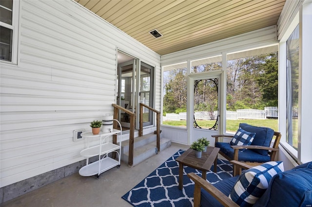 sunroom / solarium featuring plenty of natural light