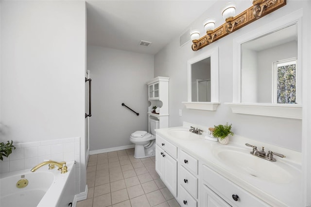 full bath with tile patterned flooring, double vanity, toilet, and a sink
