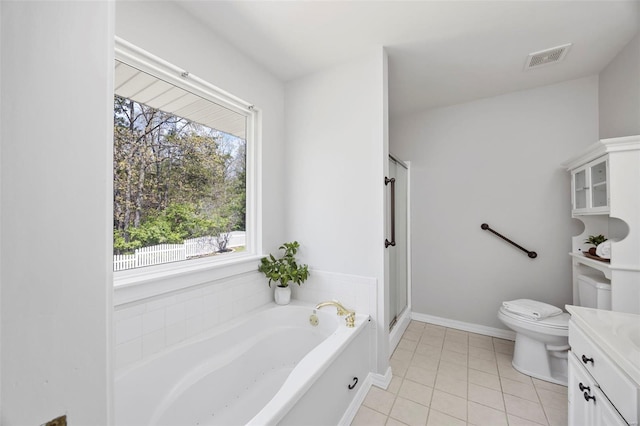 full bathroom with a bath, tile patterned floors, toilet, visible vents, and vanity