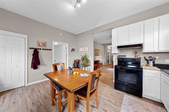 dining space featuring light wood-style flooring