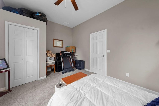 carpeted bedroom with visible vents, a ceiling fan, and baseboards