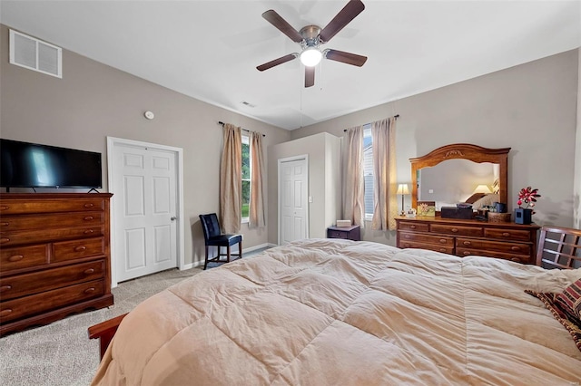 bedroom with visible vents, a ceiling fan, carpet, and baseboards