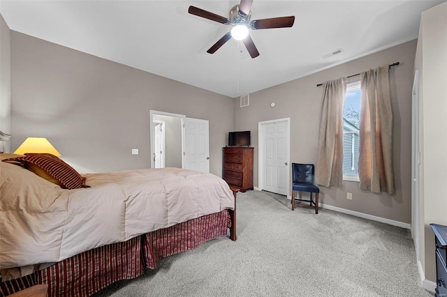 bedroom with attic access, baseboards, visible vents, and carpet
