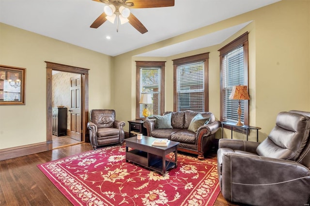 living area with recessed lighting, wood finished floors, a ceiling fan, and baseboards