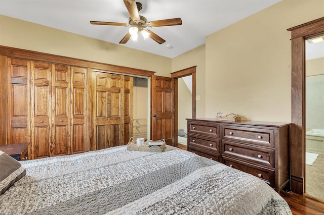 bedroom featuring ceiling fan, wood finished floors, and a closet