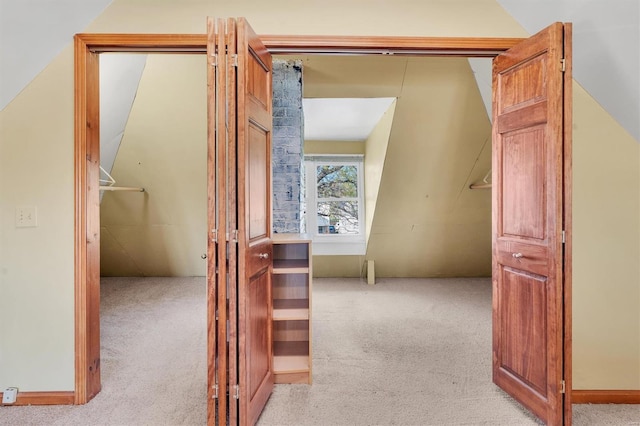 corridor with light colored carpet